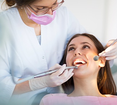 Woman receiving periodontal cleaning