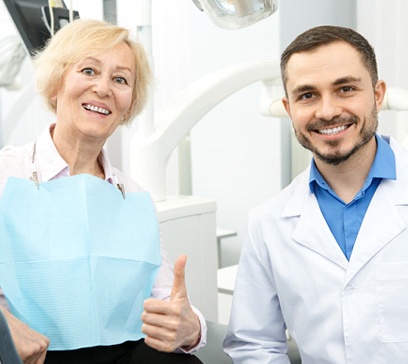 Implant dentist in Bethel Park and patient smiling