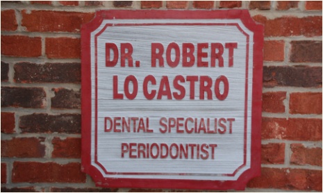 Robert J LoCastro D M D sign on office wall