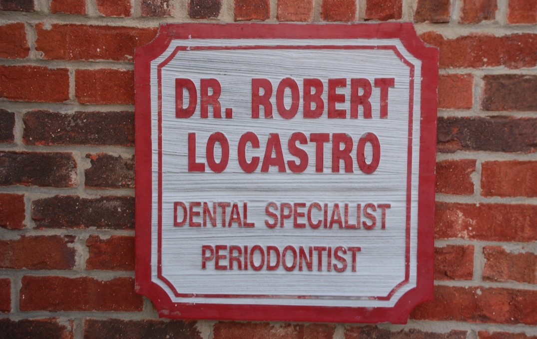 Robert J LoCaster D M D periodontal office sign