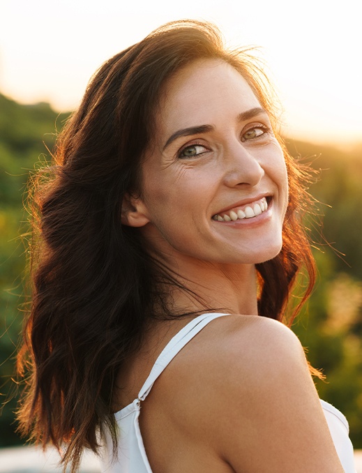 Woman sharing healthy smile after periodontal therapy