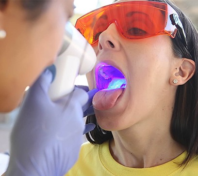 Dental patient receiving oral cancer screening