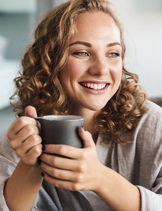 Woman sharing healthy smile after surgical periodontal treatment