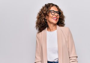 woman smiling after getting dental implants